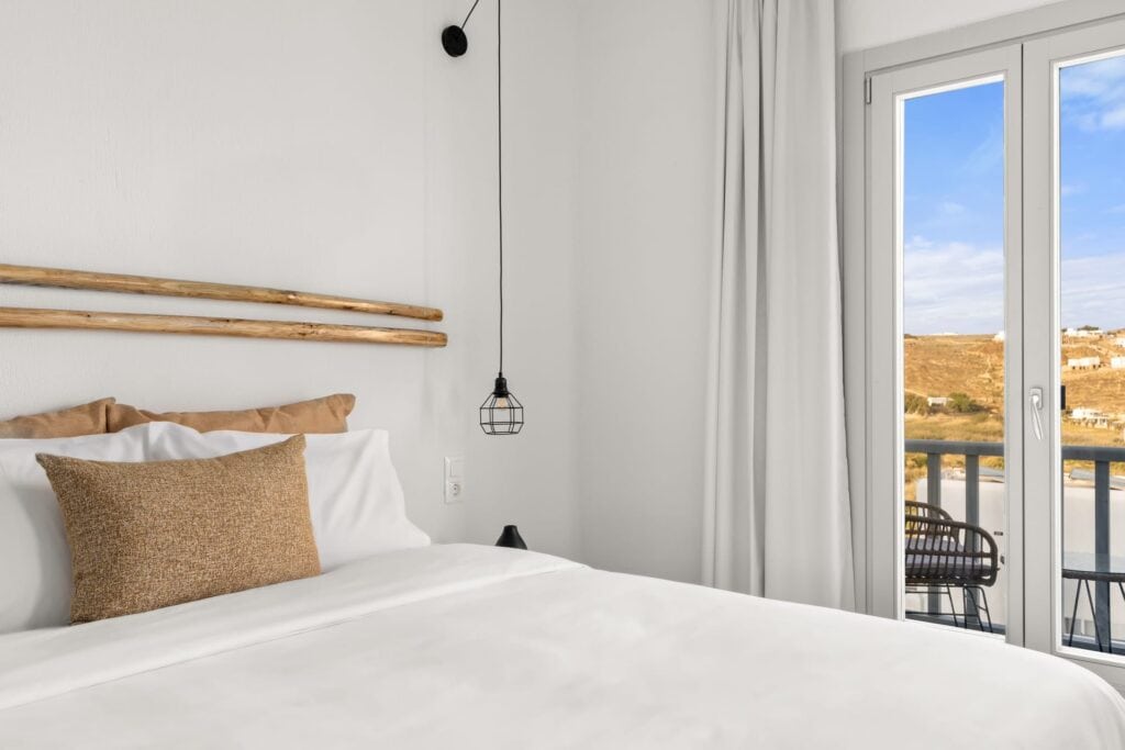 Comfort double room with modern decor and balcony views in the Cyclades. Perfect for relaxing stays.