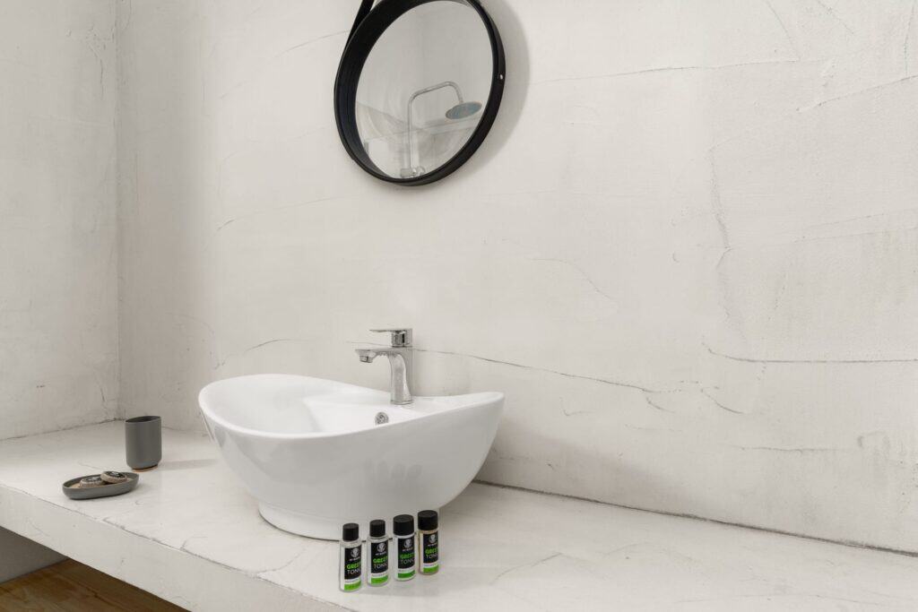 Modern bathroom with white sink and minimalist decor.