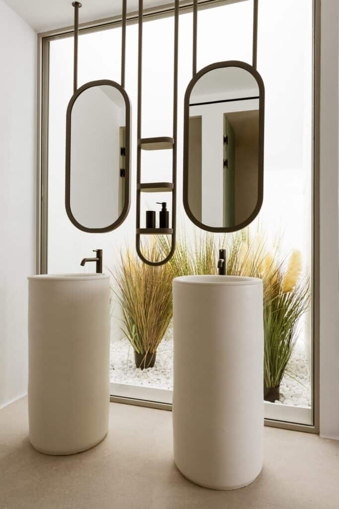 Elegant bathroom with modern mirrors and minimalist design in Cyclades.