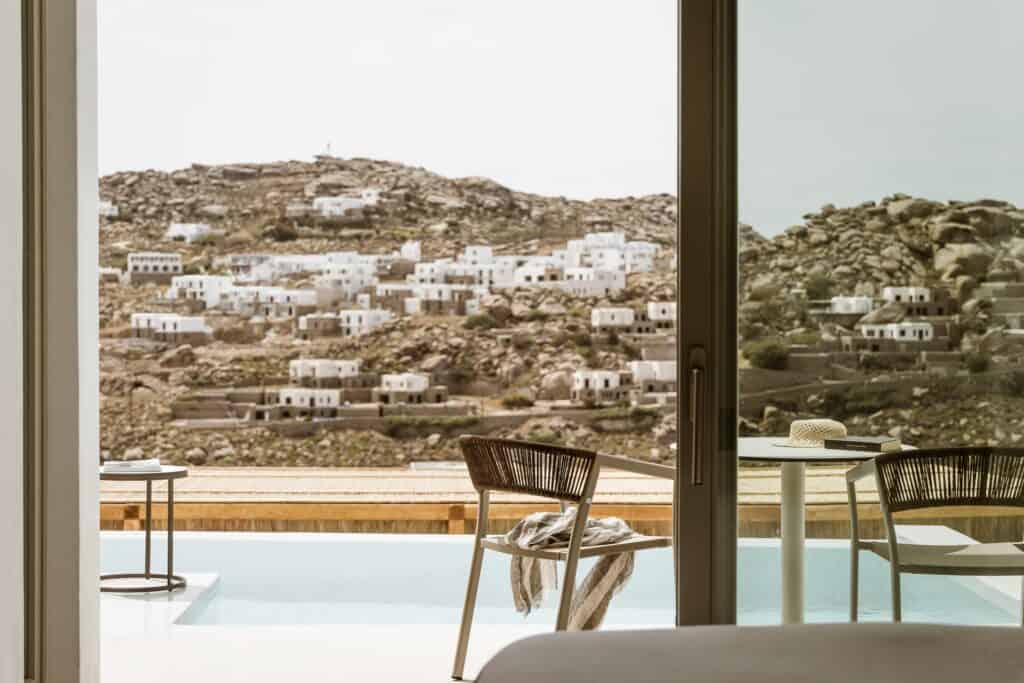 Pool suite with side sea view in Cyclades, perfect for relaxing holidays.