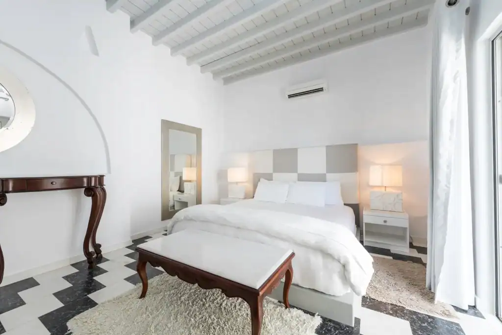 Elegant superior room with side sea view in Mr and Mrs White Hotels Cyclades.