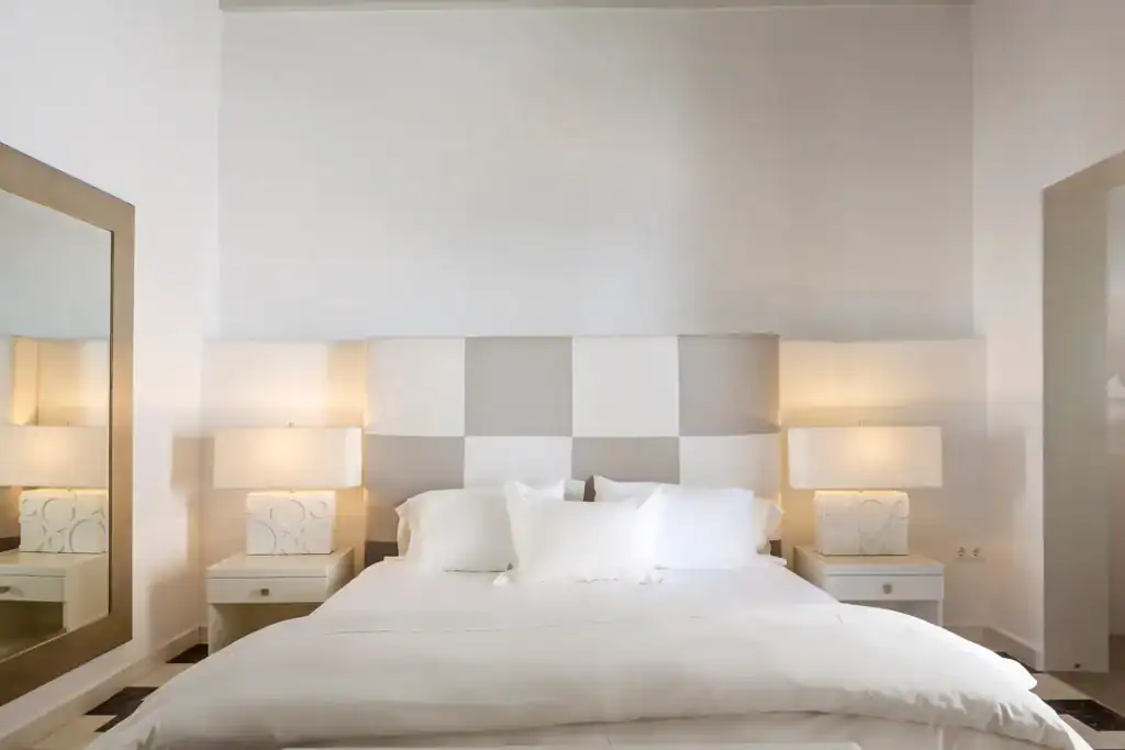 Elegant superior room with side sea view in Mr and Mrs White Hotels Cyclades. Perfect for a relaxing.