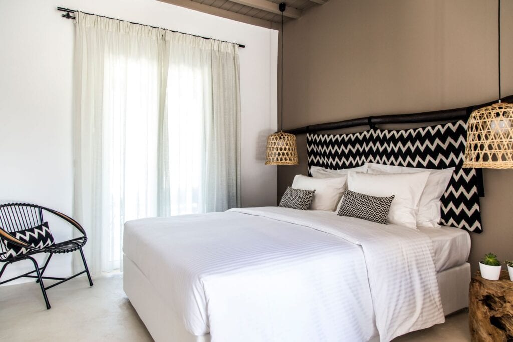 Double room with sea view and modern decor at Mr and Mrs White Hotels Cyclades.