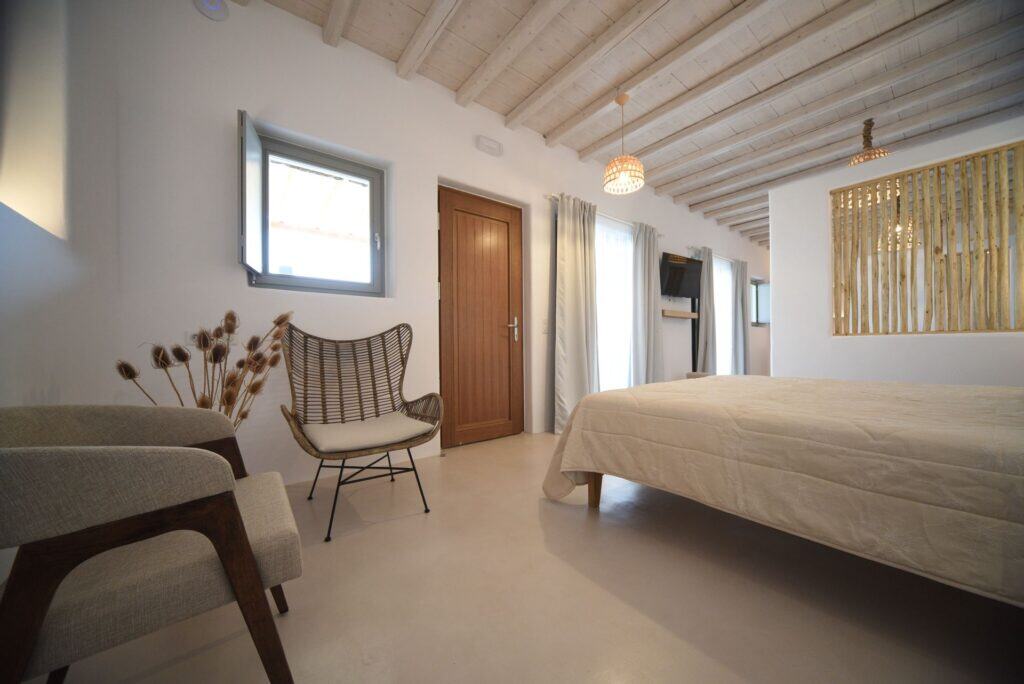 Elegant master suite with private plunge pool in Cyclades, Greece.