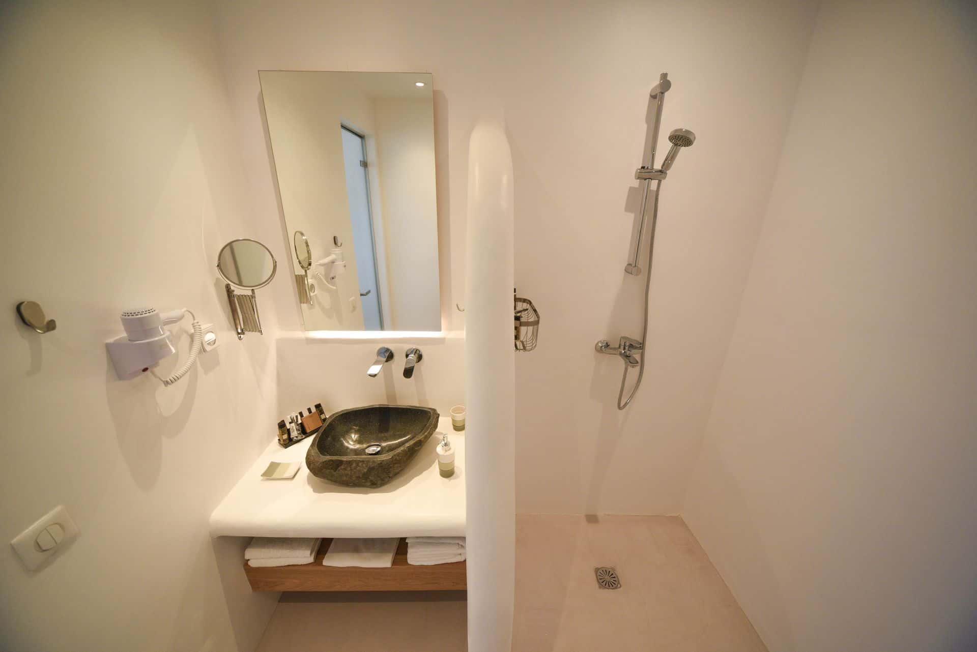 Elegant bathroom with walk-in shower and contemporary sink in the Master Suite with Plunge Pool.