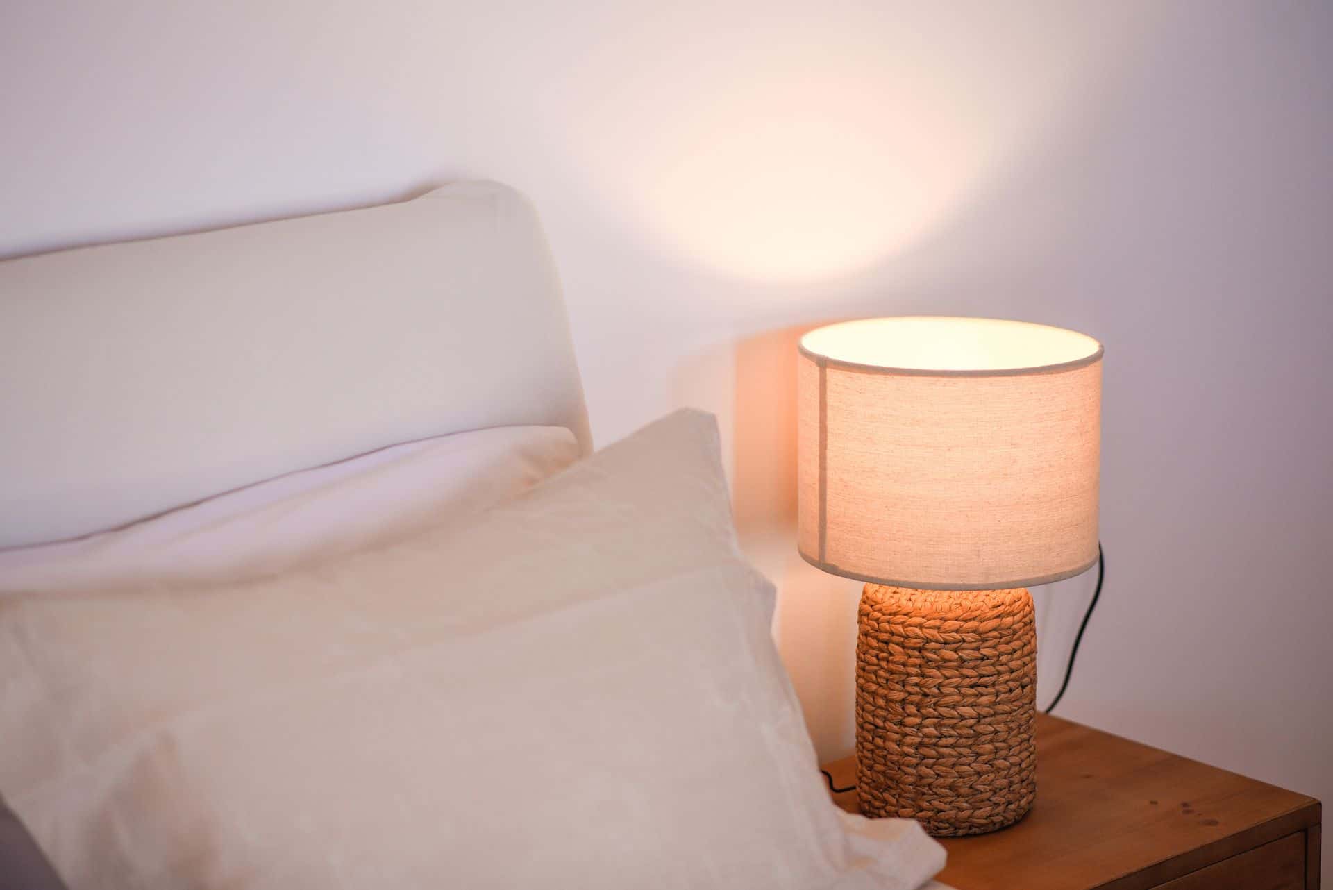 Elegant master suite with plush bedding and soft lighting in Cyclades hotel.