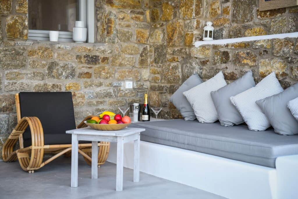 Comfortable master suite with a relaxing plunge pool and stone wall decor in Mr and Mrs White Hotels.