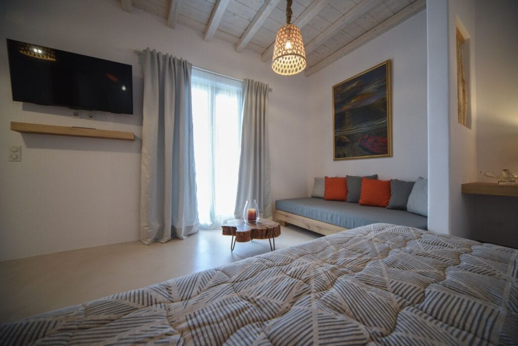Luxury Cyclades executive suite with private plunge pool and modern decor.