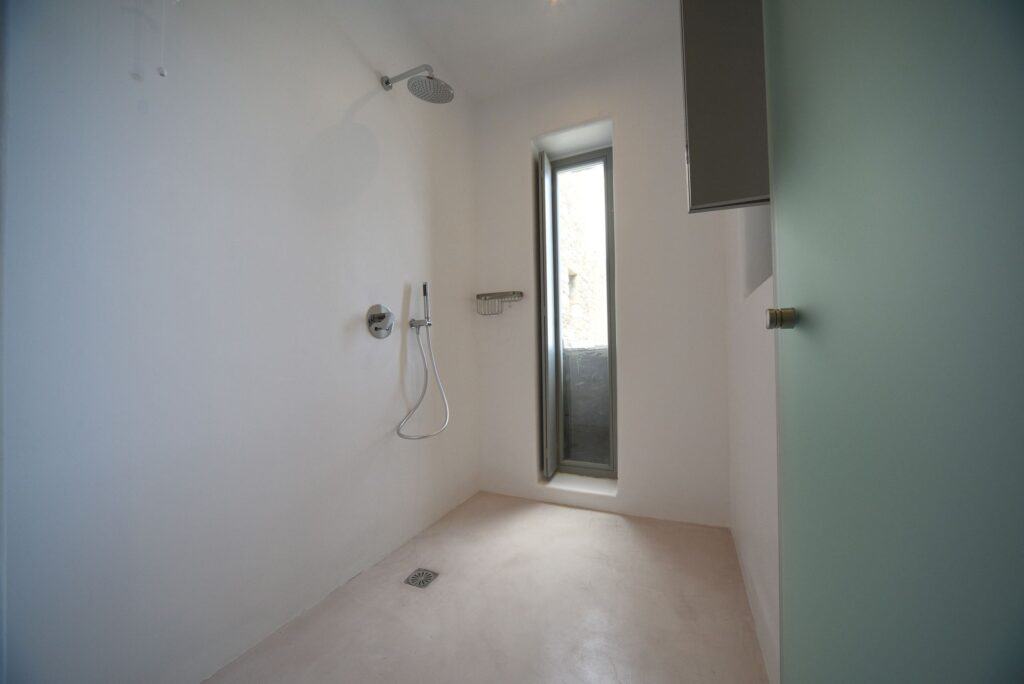 Modern bathroom in executive suite with private plunge pool at Mr and Mrs White Hotels Cyclades.