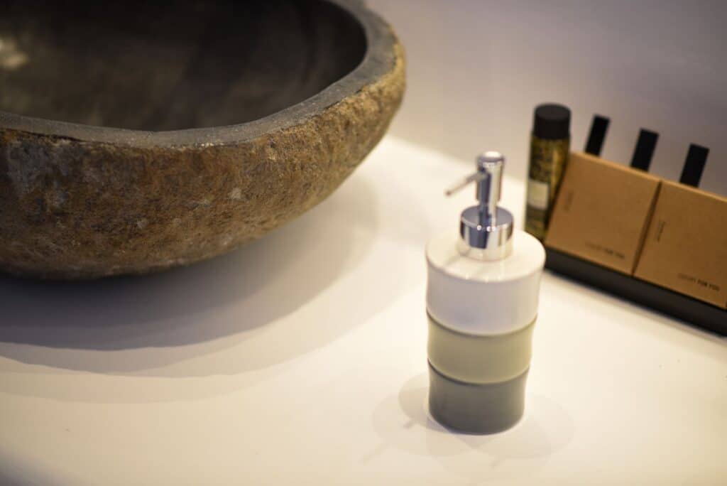 Luxurious bathroom with stone sink and modern toiletries, perfect for relaxing Executive Suite with.