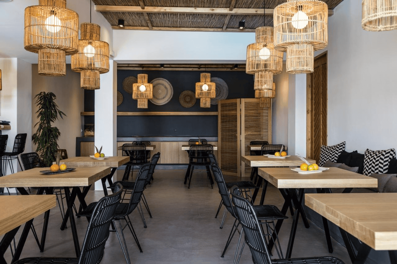 Interior view of a stylish boutique hotel in Mykonos with modern decor and cozy seating areas.