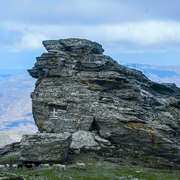 Majestic rock formation on Andros Island, Cyclades, Greece, with scenic views and rugged landscape.