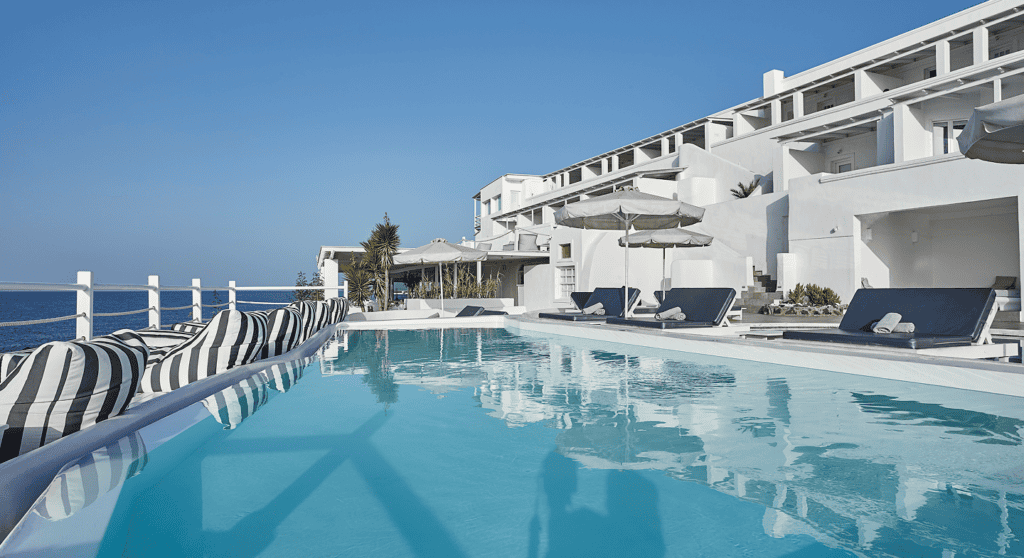 Luxury pool with stunning sea views at Notos Therme and Spa, part of Mr and Mrs White Hotels in Cycl.