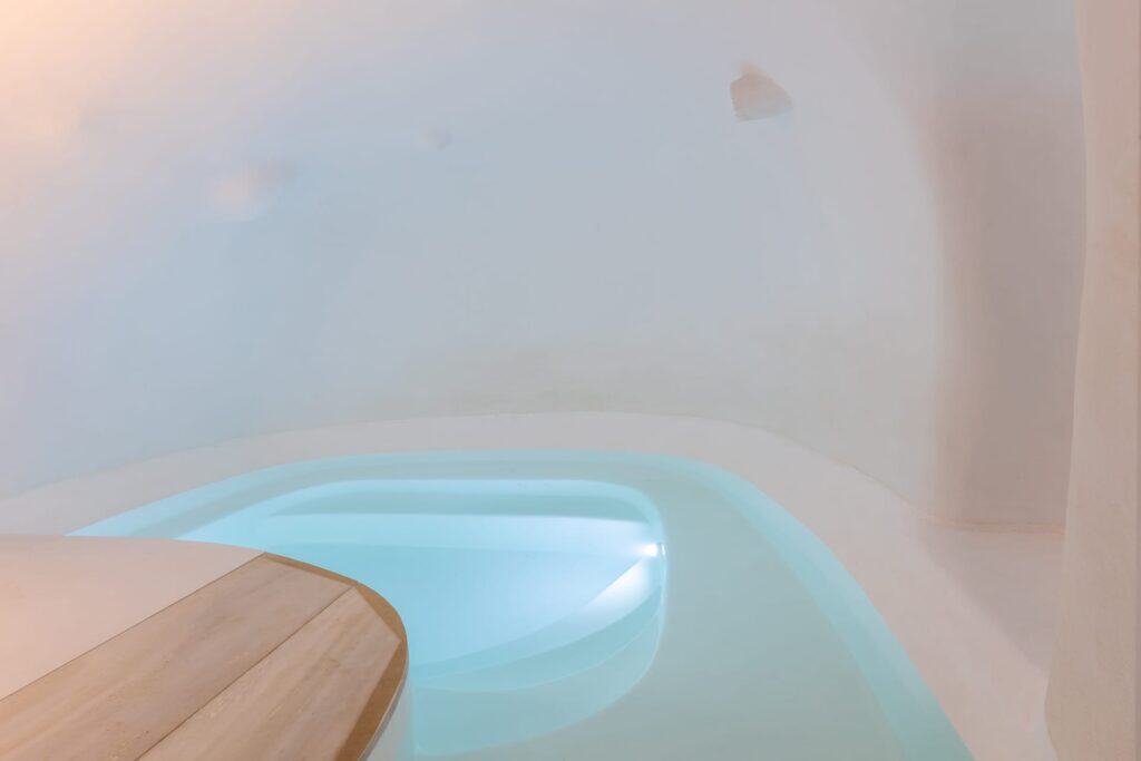 Indoor pool at Heavens Edge Villa, part of Mr and Mrs White Hotels Cyclades. Luxurious accommodation.