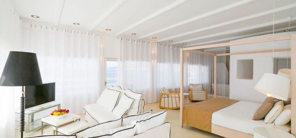 Sea view Notos Suite interior with modern decor and bright natural light.