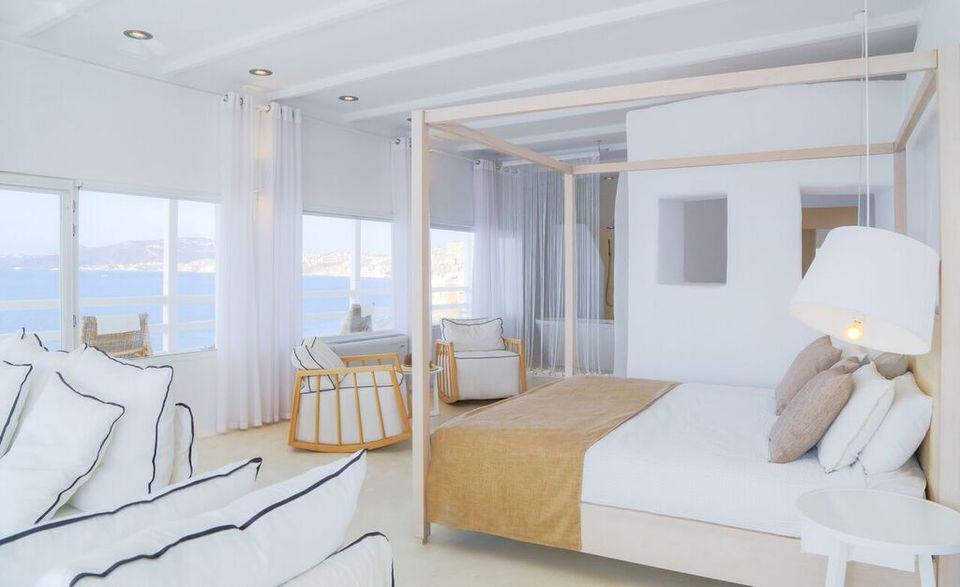 Luxurious Notos Suite with sea view and modern decor at Mr and Mrs White Hotels.