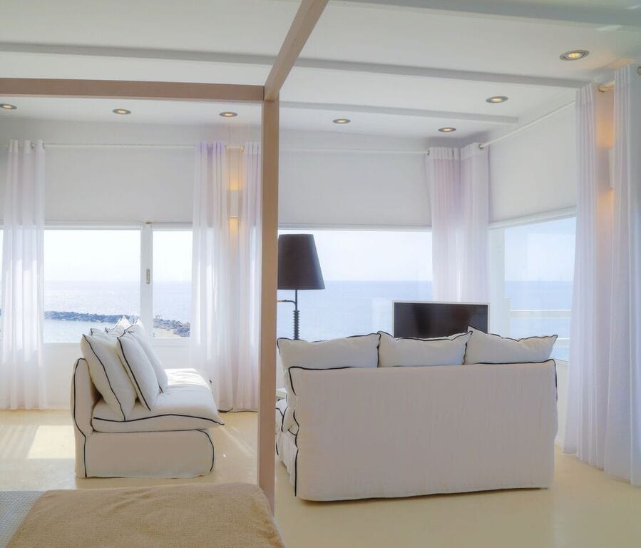 Sea View Notos Suite with modern decor and panoramic ocean views.