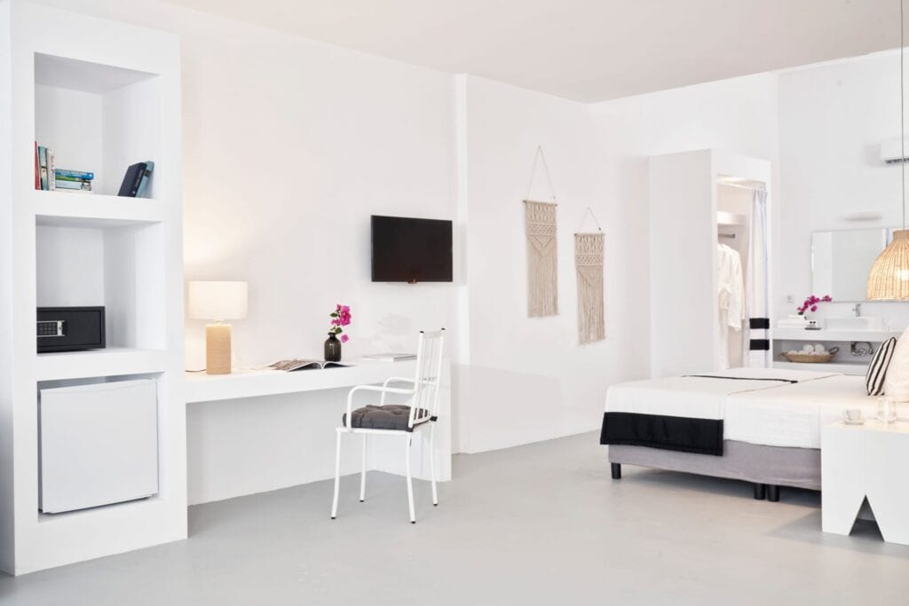 Bright one-bedroom suite with garden view, stylish decor, and modern amenities in Cyclades.