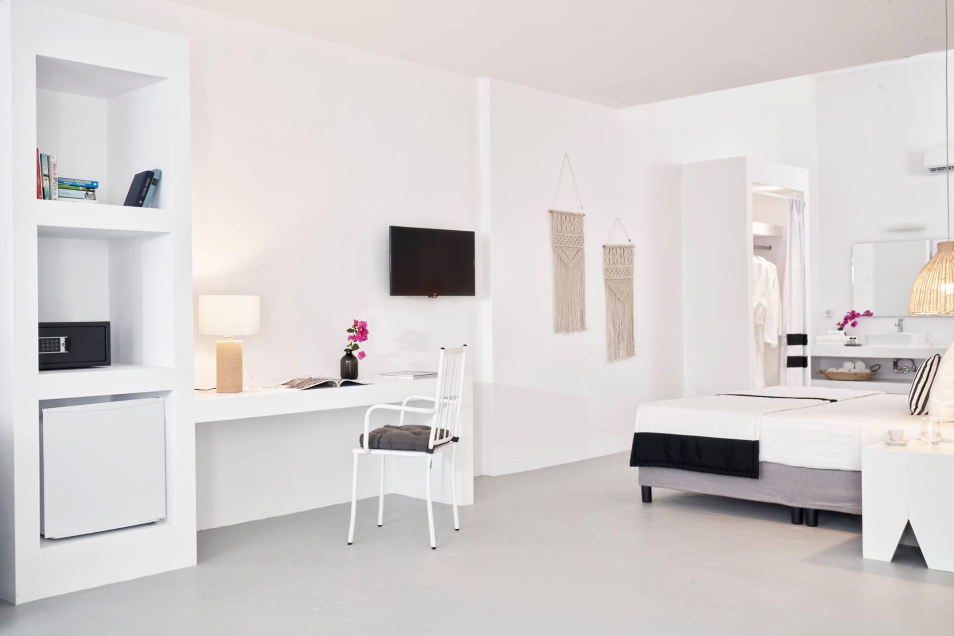 Bright one-bedroom suite with garden view, stylish decor, and modern amenities in Cyclades.