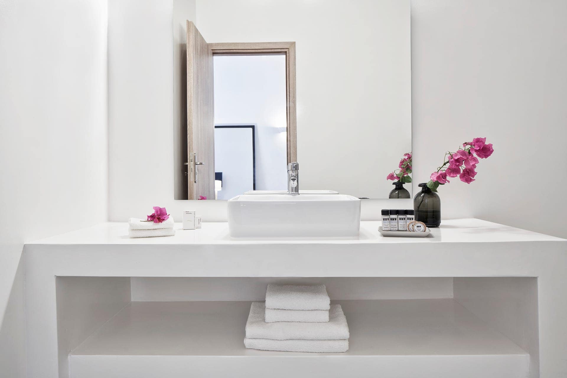Elegant bathroom in Mr and Mrs White Hotels Cyclades with modern design and garden view.