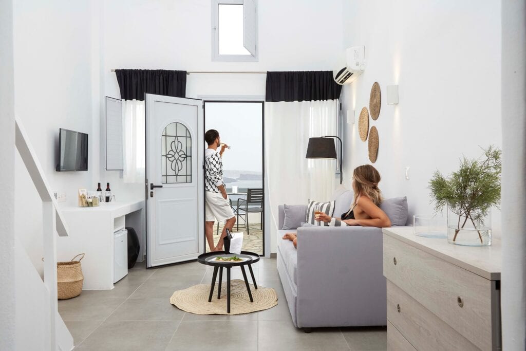 Elegant room with caldera view in Mr and Mrs White Hotels Cyclades. Perfect for a relaxing stay in S.