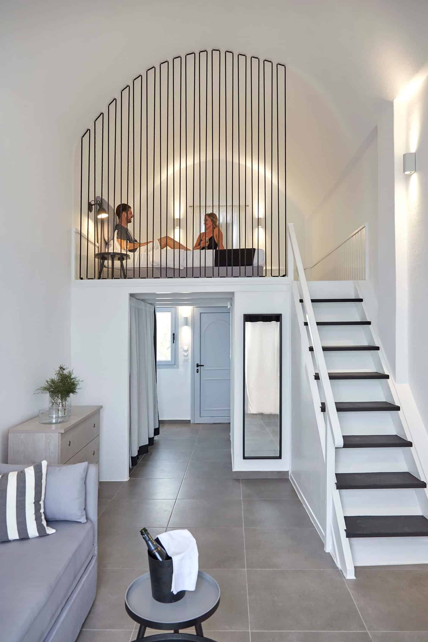 Caldera view from a superior hotel room in the Cyclades, featuring modern decor and cozy ambiance.