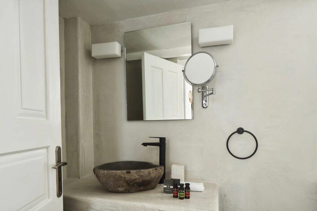 Elegant bathroom in Superior Room with Caldera View, featuring modern amenities and stylish decor.