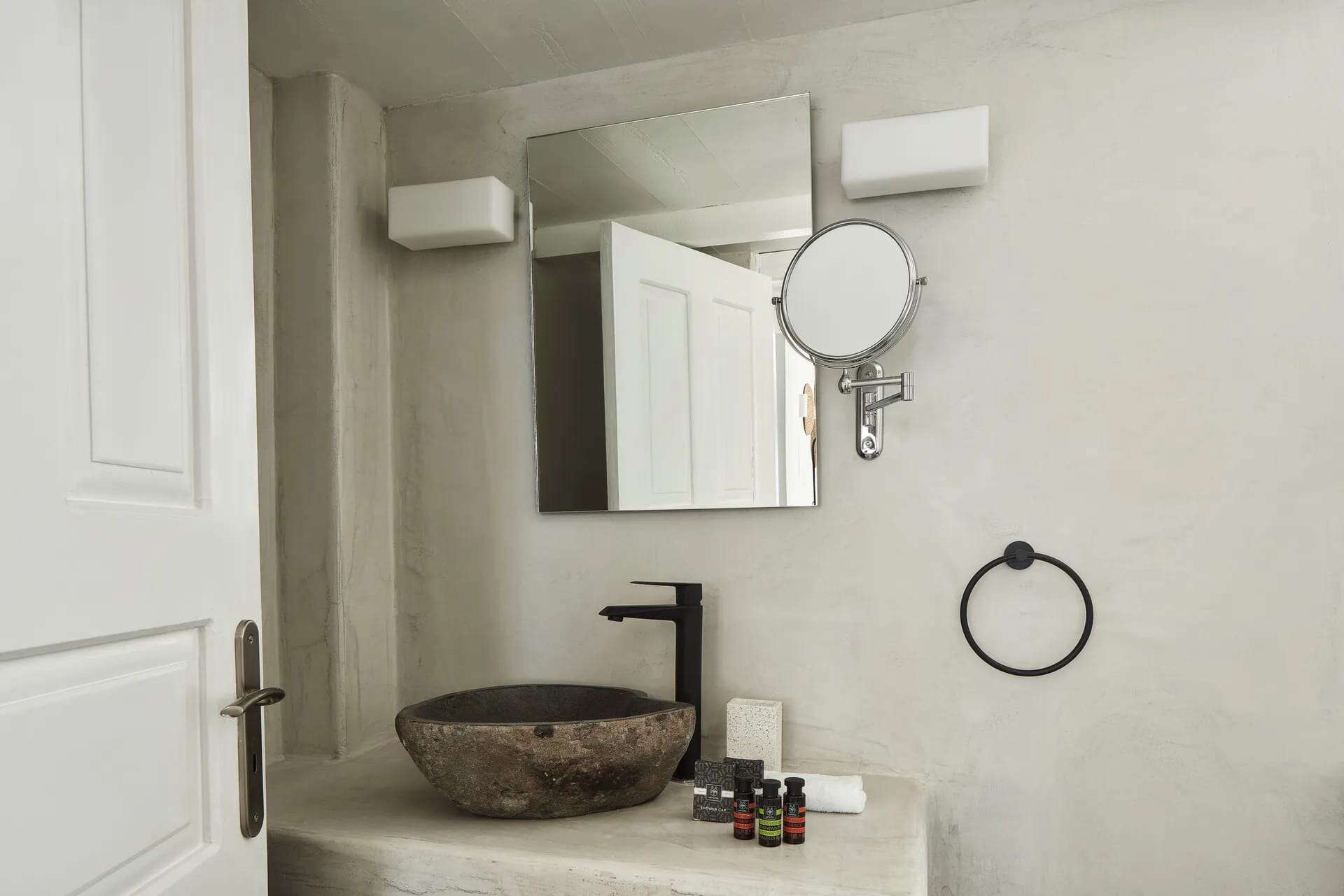 Elegant bathroom in Superior Room with Caldera View, featuring modern amenities and stylish decor.