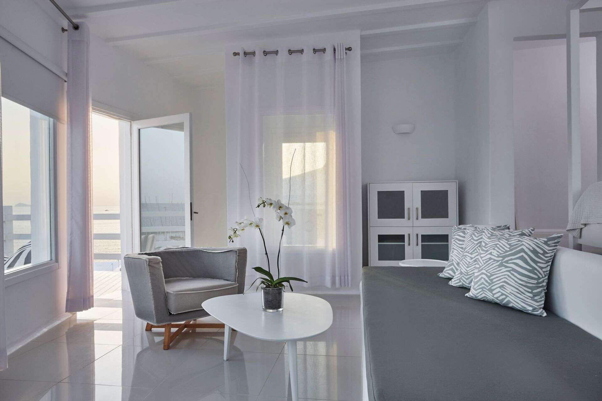 Sea view Notos Suite with stylish decor and bright natural light.