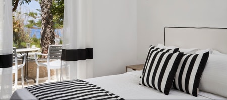 Sea View Double Room with Modern Decor and Black-and-White Accents.