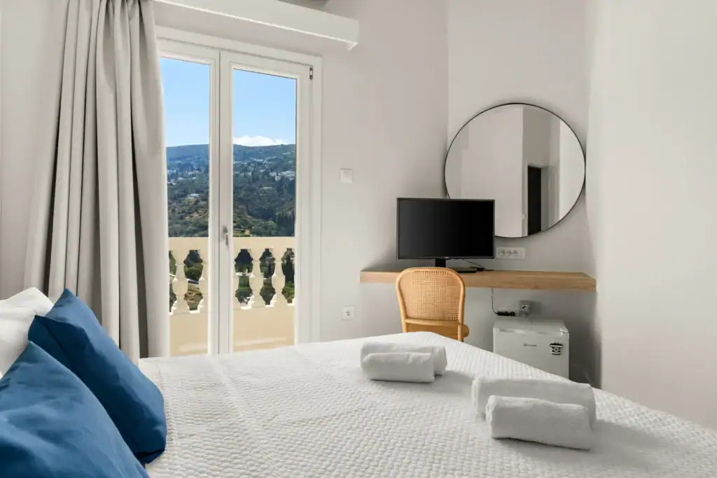 Elegant suite with balcony overlooking scenic landscape in Cyclades. Perfect for a relaxing stay at.