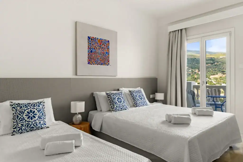 Sea view superior triple room with modern decor and comfortable bedding. Perfect for relaxing stays.