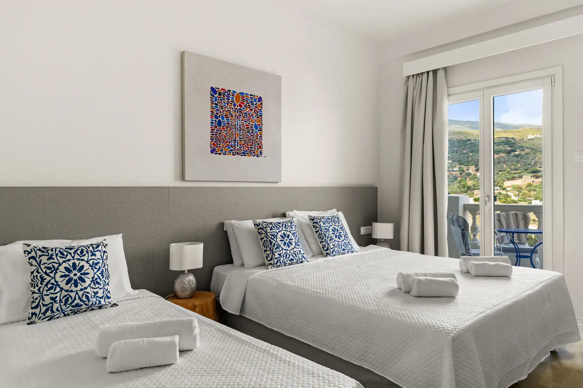 Sea view superior triple room with modern decor and comfortable bedding. Perfect for relaxing stays.