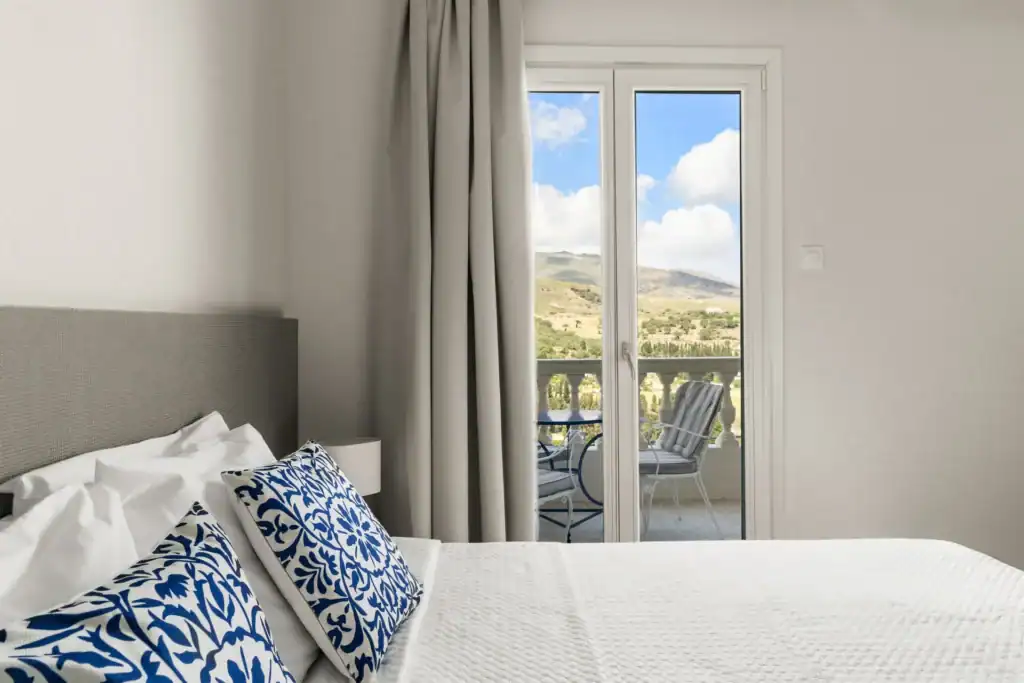 Sea view room with balcony and modern decor, perfect for a relaxing stay in the Cyclades.