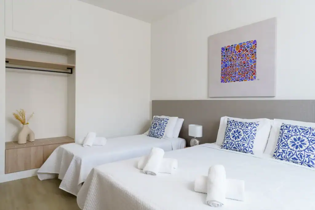 Sea view superior triple room with modern decor and comfortable beds at Mr and Mrs White Hotels Cycl.