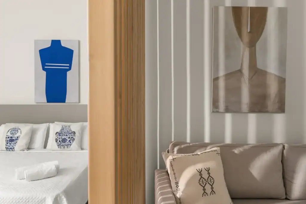 Modern suite with sea view, stylish decor, and cozy furnishings in Cyclades hotel.
