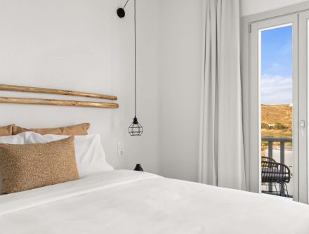 Comfort double room with modern decor and balcony views in the Cyclades. Perfect for relaxing stays.