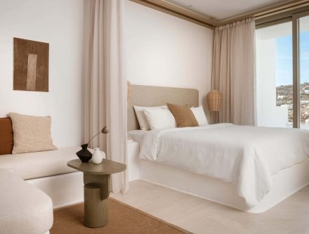 Junior Jetted Tub Suite with Side Sea View in Cyclades, featuring a luxurious bathtub and scenic oce.