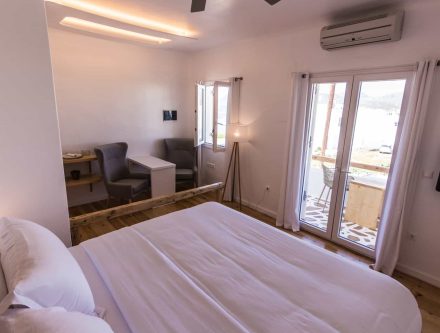 Elegant Cyclades hotel room with side sea view and modern amenities.