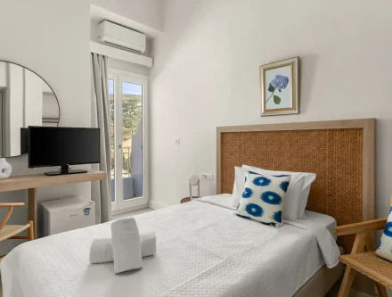 Comfortable hotel room in the Cyclades with modern amenities and a bright, airy atmosphere. Perfect.