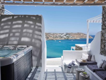 Sea view junior suite with heated outdoor tub in Mr and Mrs White Hotels Cyclades.