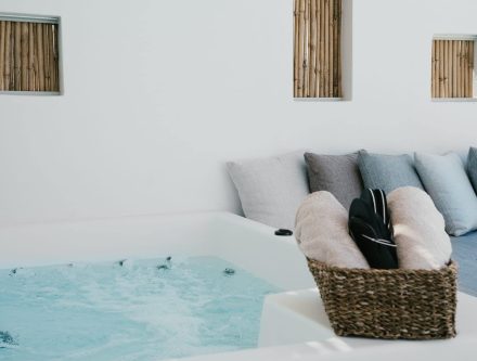 Luxury Jacuzzi room with cozy seating, plush cushions, and modern design in Mr and Mrs White Hotels.