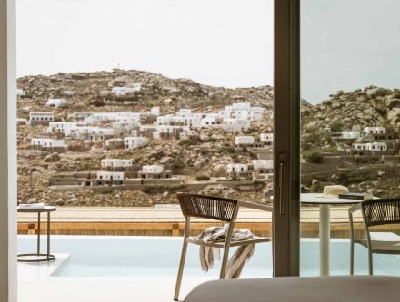 Junior Pool Suite with sea view and private balcony, perfect for relaxing stays in the Cyclades.
