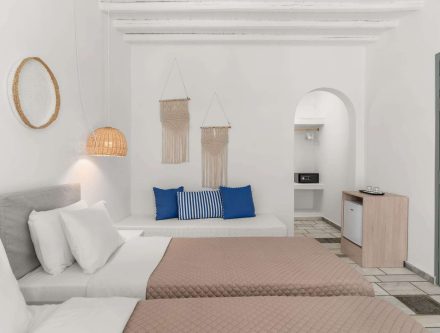 Comfortable hotel room with courtyard view, modern decor, and relaxing ambiance in the Cyclades.