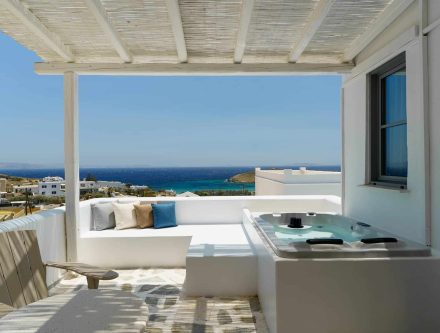 Sea view from White Suite with outdoor jet tub in Cyclades, Greece.