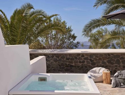 Luxurious Nior Suite with private jetted tub and garden views in Cyclades. Perfect for a relaxing ge.