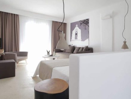 Sea view junior suite at Mr and Mrs White Hotels Cyclades with modern decor and spacious balcony.