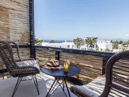 Balcony with town and sea views at Mr and Mrs White Hotels Cyclades.