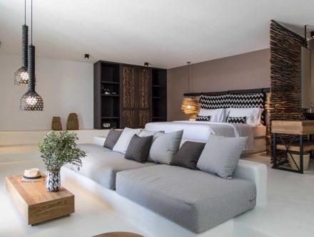 Modern interior of a one-bedroom pool suite with stylish decor and cozy seating area.