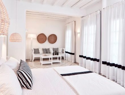 Elegant junior suite with pool view, jetted tub, and stylish decor in Mr and Mrs White Hotels Cyclad.